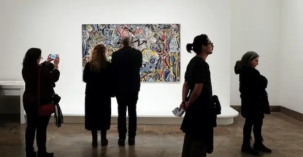people looking at art