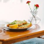 tray with avocado toast and flowers