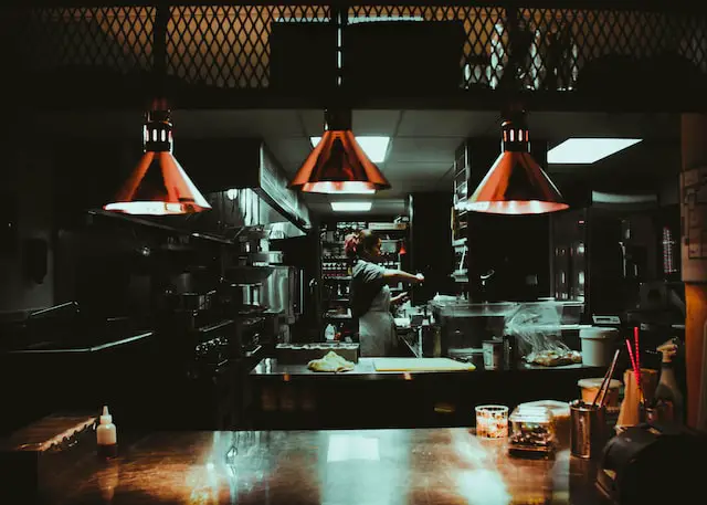 woman cooking in restaurant