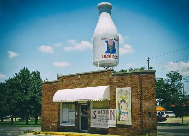 small building with braums milk bottle on top