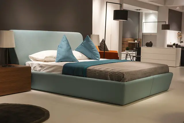 modern hotel room with bed and furniture