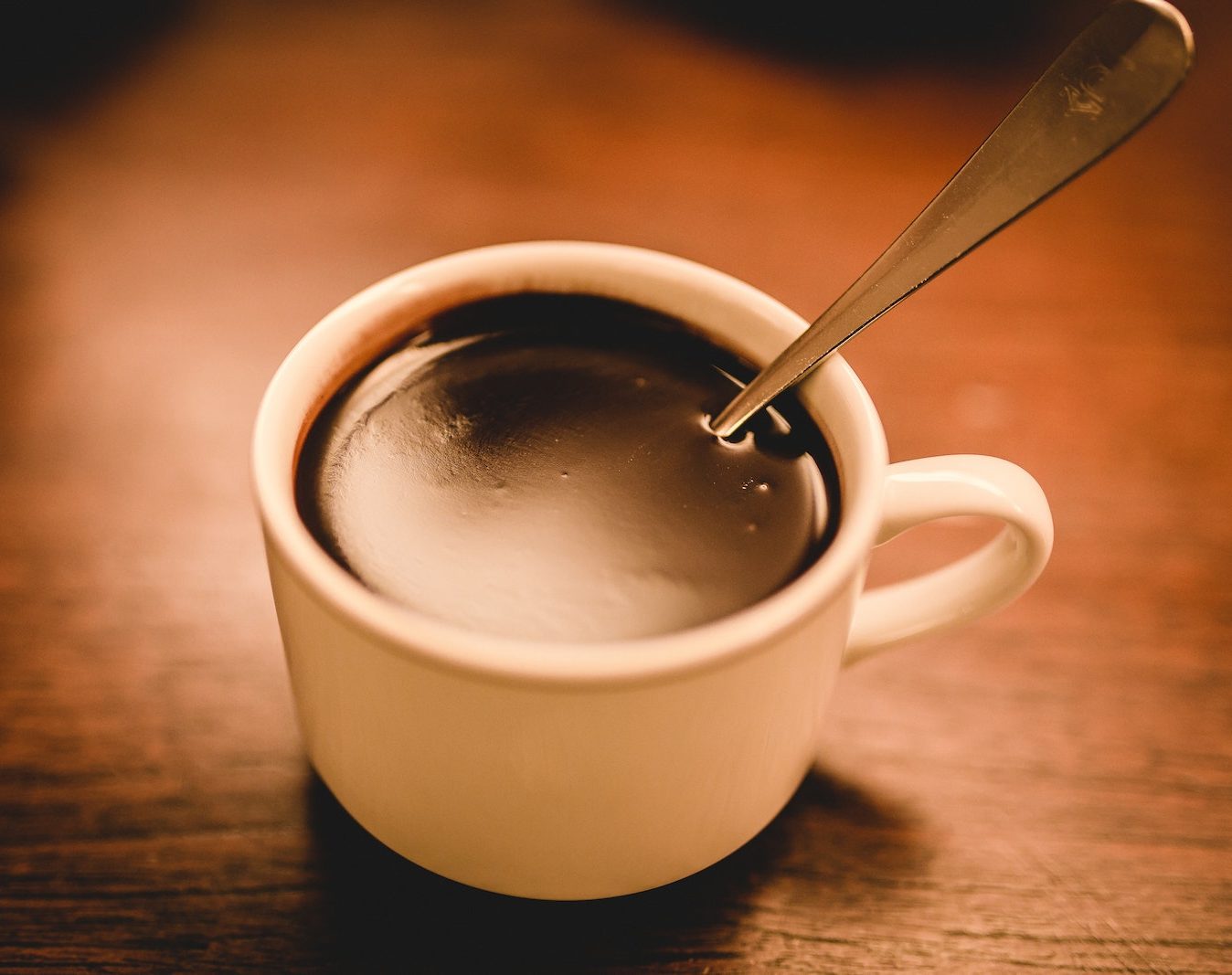 cup of hot chocolate with a spoon sticking out of mug