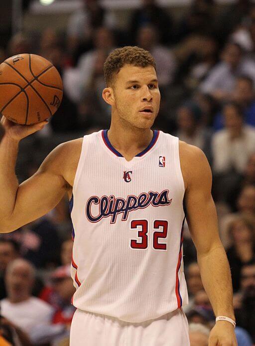 Blake Griffin holding a basketball in a Clippers number 32 jersey