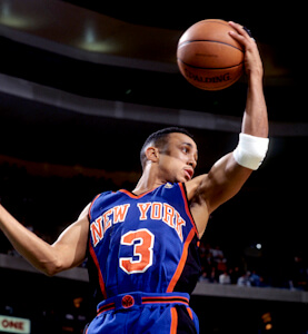 John Starks in his New York number 3 jersey in the air with a basketball