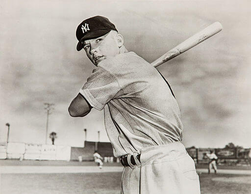 Mickey Mantle holding a baseball bat in a 1951 photo