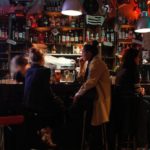 people having a drink at a bar