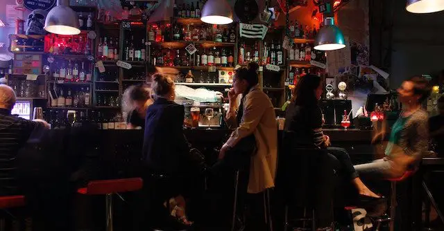 people having a drink at a bar