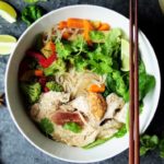 bowl of pho with chicken and vegetables