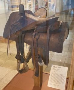 saddle in a display case at the OKC cowboy museum