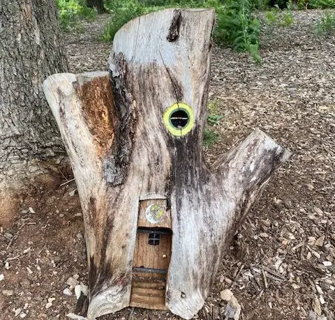 small gnome house made out of a tree stump