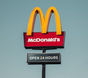 mcdonalds sign with open 24 hours underneath