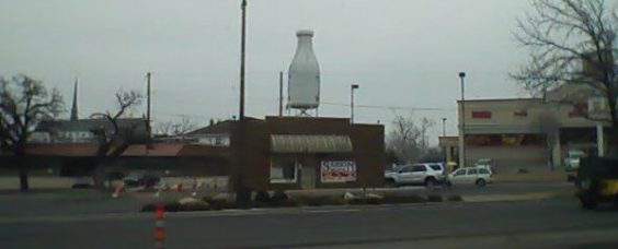 building with giant milk bottle on top