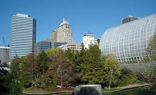 myriad botanical gardens in oklahoma city with trees and greenhouse, oklahoma city skyline in the background