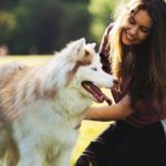 woman petting dog