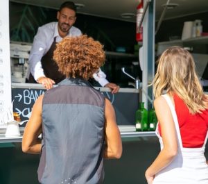 2 people ordering from a food truck