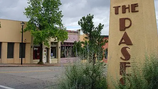 the paseo sign and commercial buildings