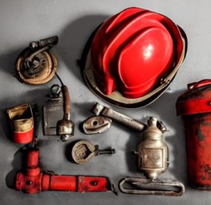 vintage firefighter equipment with helmet