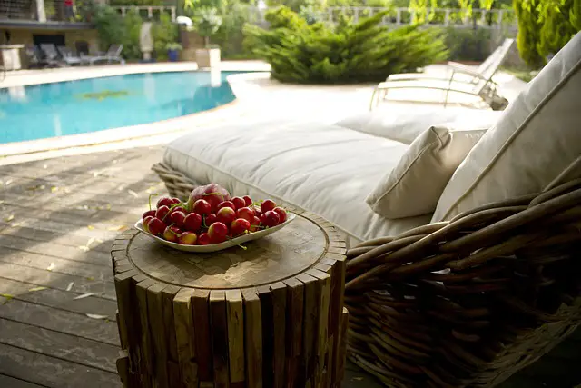 lounge chair beside hotel pool