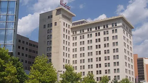 The Colcord Hotel, a stone multi story hotel