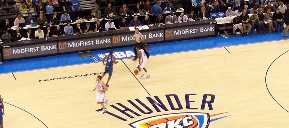 basketball players playing on the OKC thunder basketball court