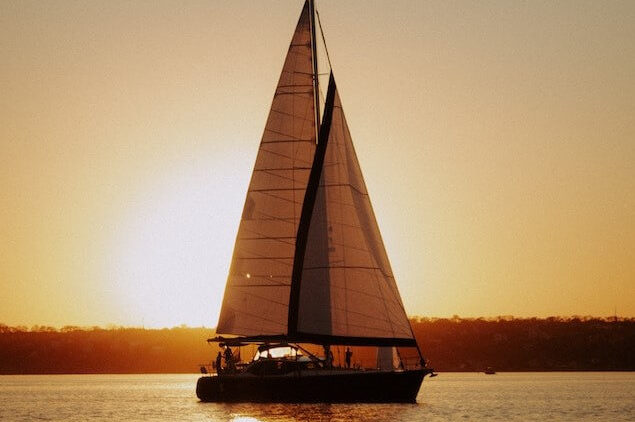 sailboat on the water at sunset