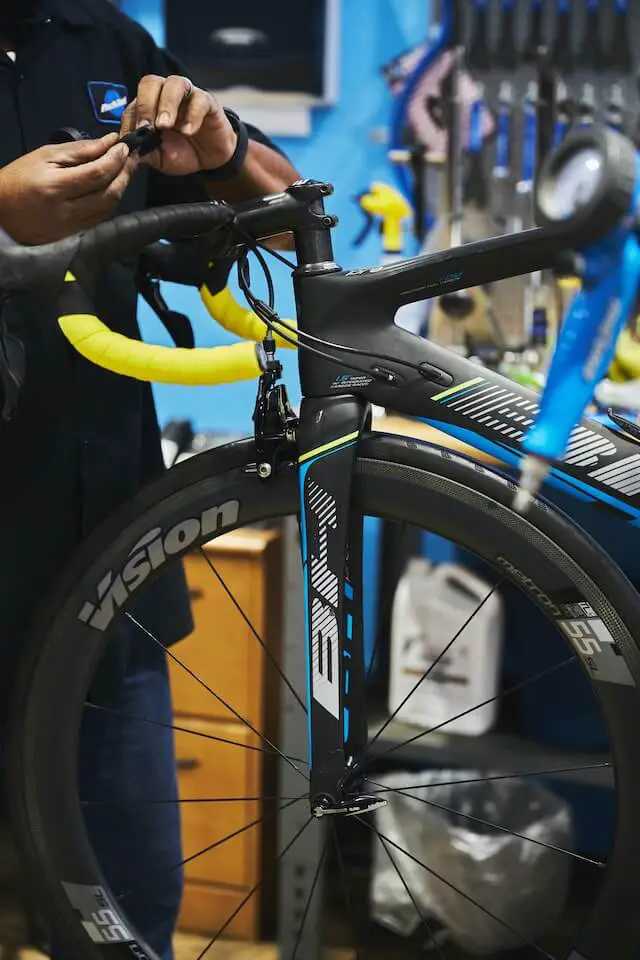 a person fixing a bicycle