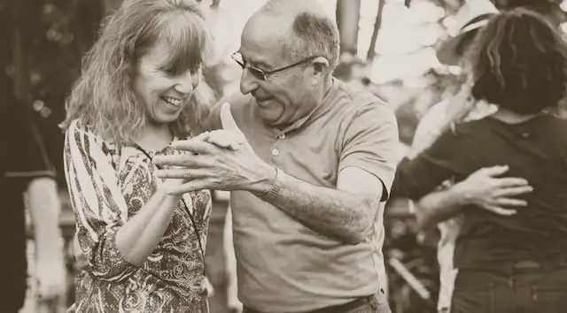 older couple dancing with each other