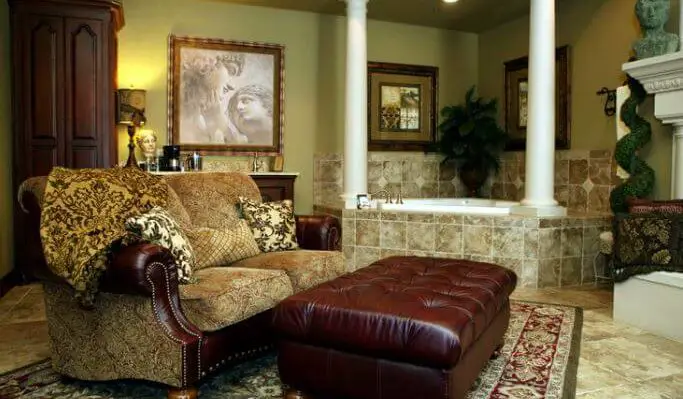 luxury bed and breakfast room with large couch ottoman, jet tub