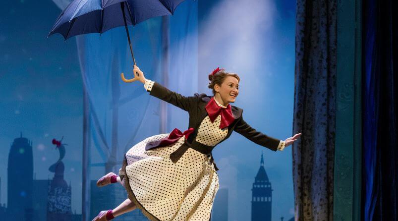 Mary Poppins flying with umbrella