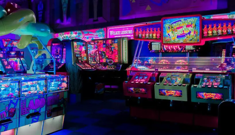 arcade games lit up with neon lights