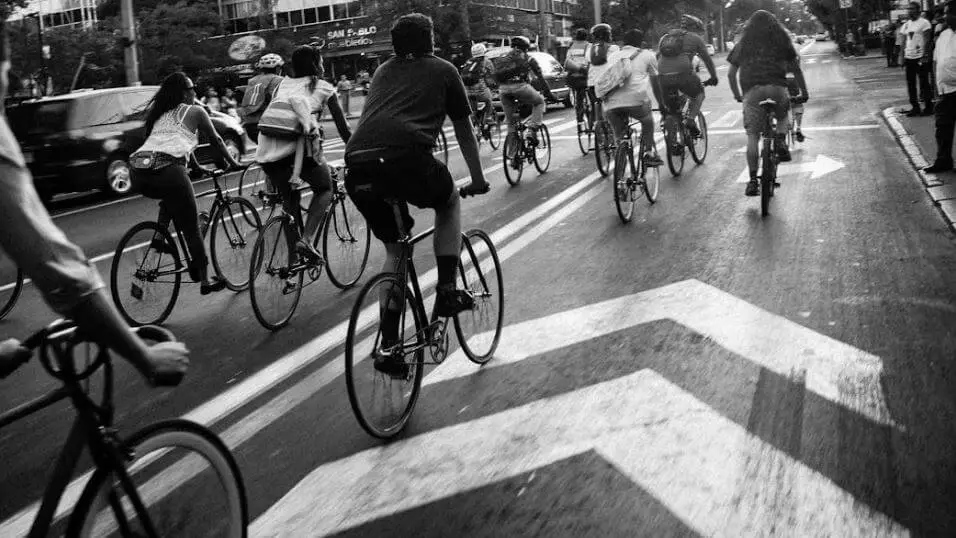 group riding bikes on city street