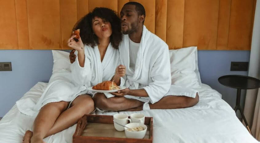 couple having breakfast in bed