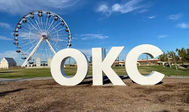 letters OKC with ferris wheel in the background