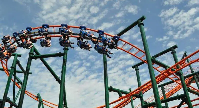 people riding on a roller coaster