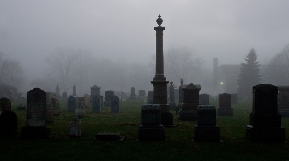 foggy cemetery with headstones