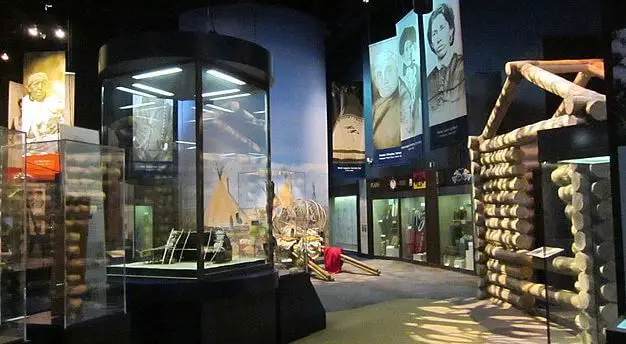 music exhibits at OKC History center with log cabin and displays