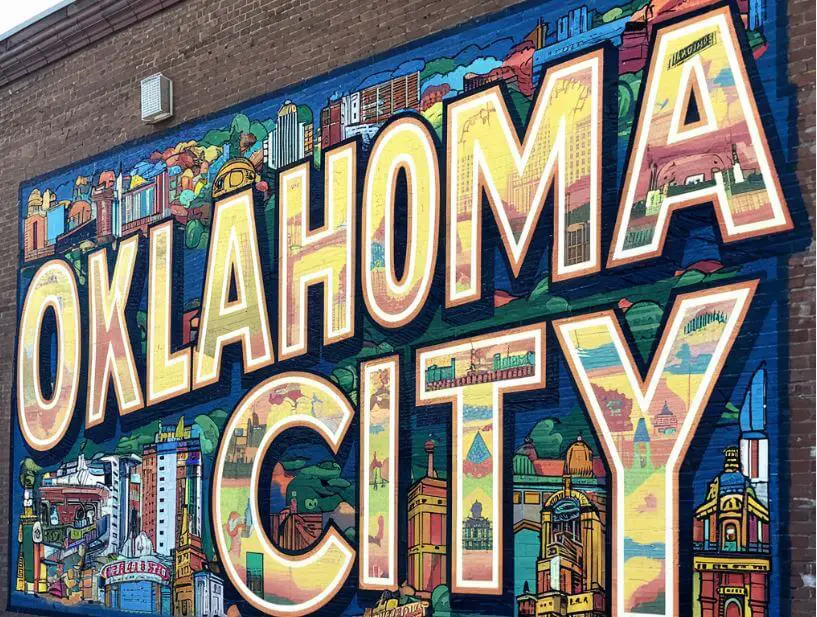 a mural on a brick wall that says Oklahoma City